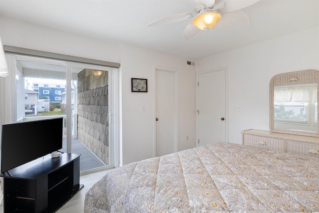 bedroom with ceiling fan and access to exterior