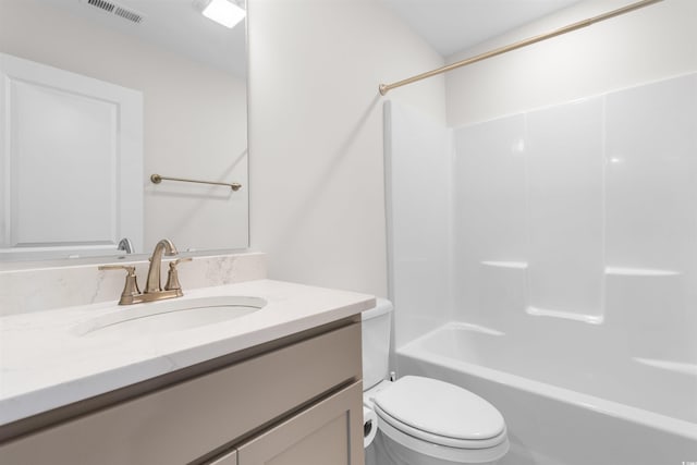 full bathroom with washtub / shower combination, vanity, and toilet