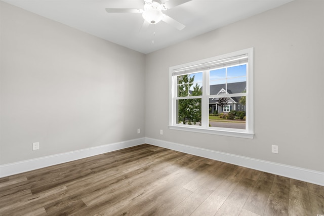 spare room featuring ceiling fan and hardwood / wood-style flooring