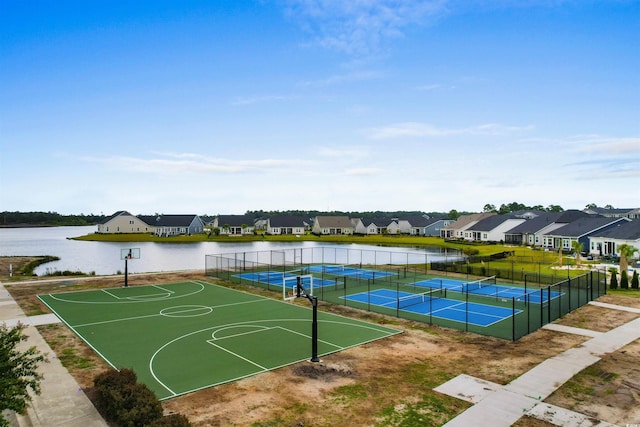 view of basketball court with a water view and tennis court