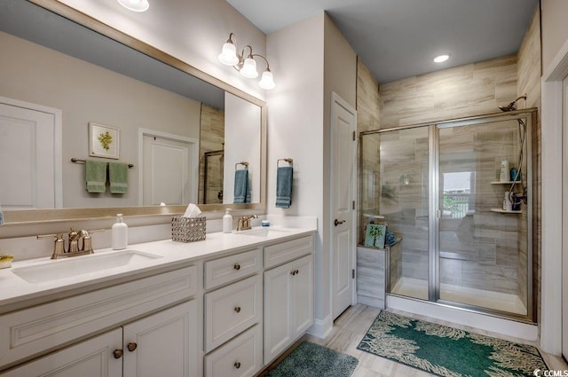 bathroom with vanity and an enclosed shower