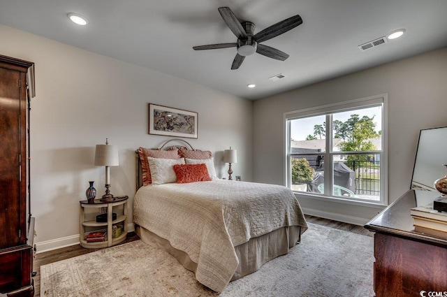 bedroom with hardwood / wood-style flooring and ceiling fan