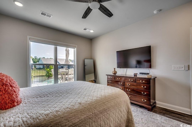 bedroom featuring dark hardwood / wood-style floors and ceiling fan