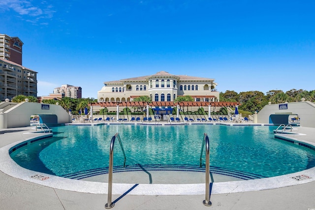 view of swimming pool featuring a patio