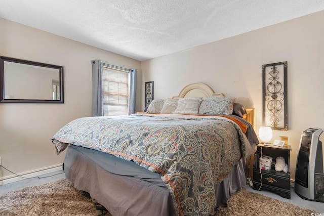 bedroom with light carpet and a textured ceiling