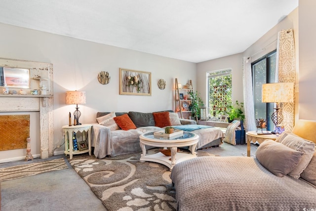 carpeted living room featuring a fireplace