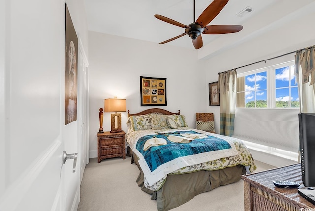 carpeted bedroom with visible vents and ceiling fan