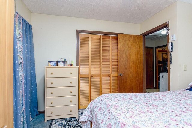 bedroom featuring a closet and a textured ceiling