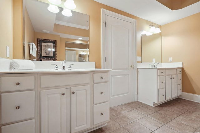 bathroom featuring tile patterned flooring, ornamental molding, and vanity