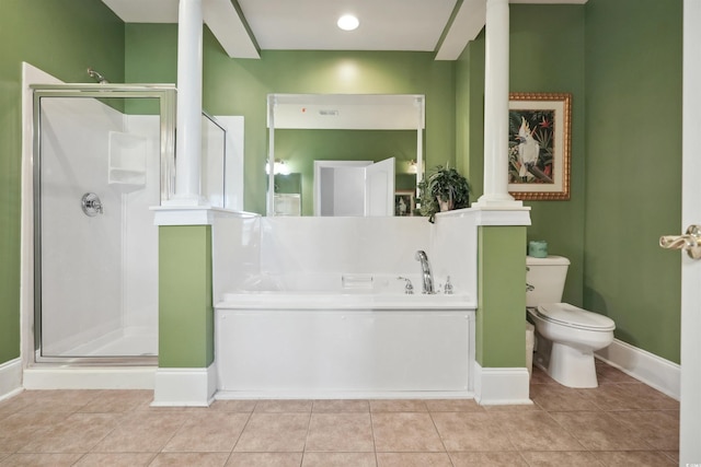 bathroom with independent shower and bath, toilet, decorative columns, and tile patterned floors