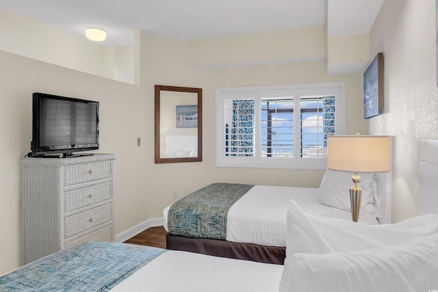 bedroom featuring dark hardwood / wood-style flooring