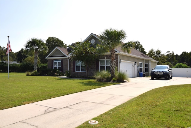 view of front of home with a garage and a front lawn