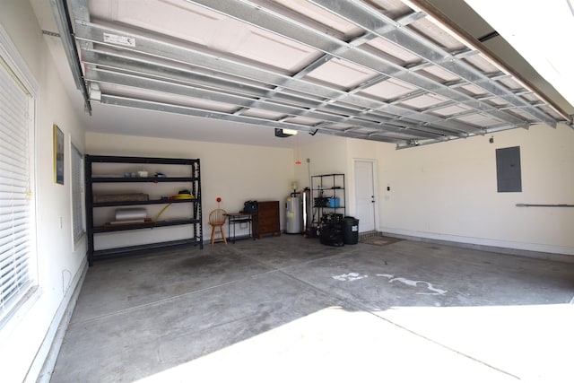 garage with a garage door opener, electric panel, and electric water heater