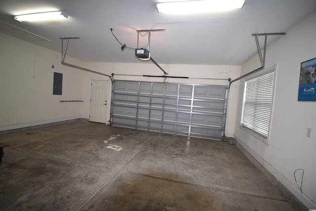 garage featuring electric panel and a garage door opener