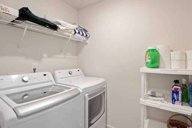 laundry room with washer and dryer