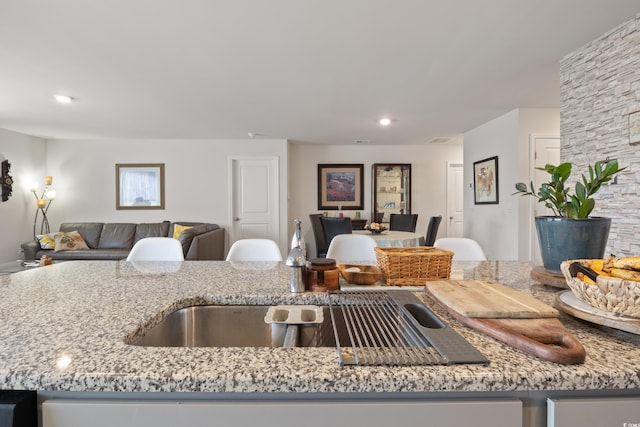 kitchen featuring light stone countertops