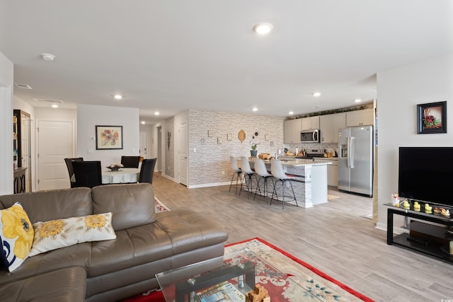 living room with light hardwood / wood-style floors