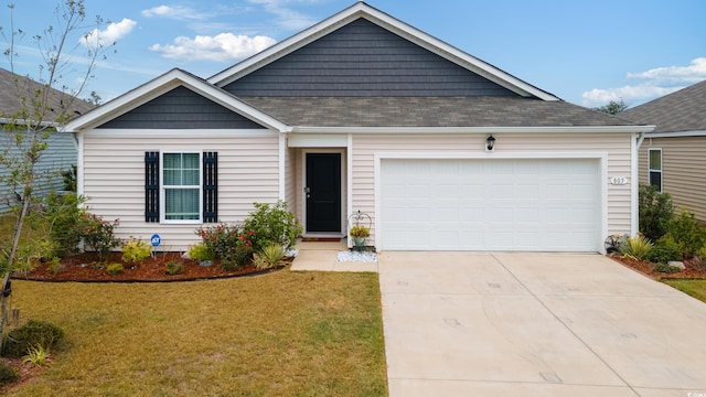 view of front facade with a front lawn and a garage