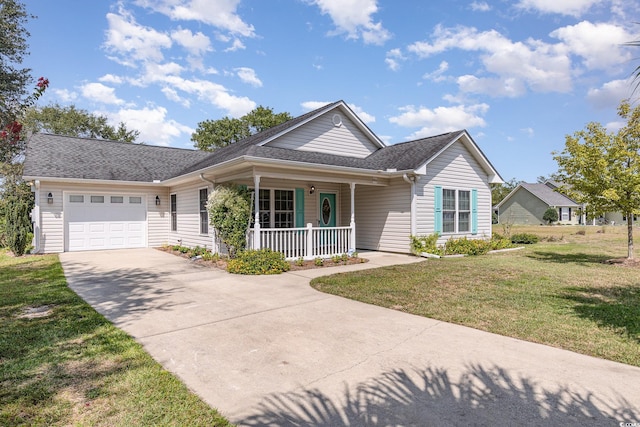 view of front of home with a garage, a porch, and a front lawn