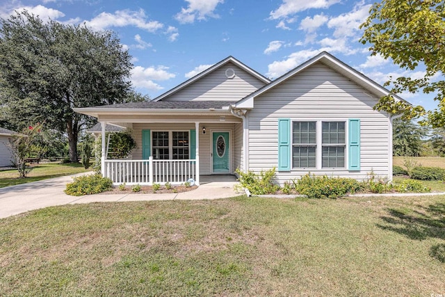 view of front of home featuring a front lawn and covered porch