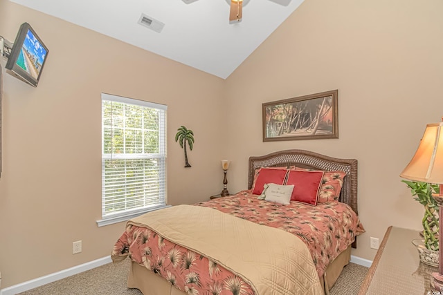 bedroom with vaulted ceiling, light carpet, and ceiling fan