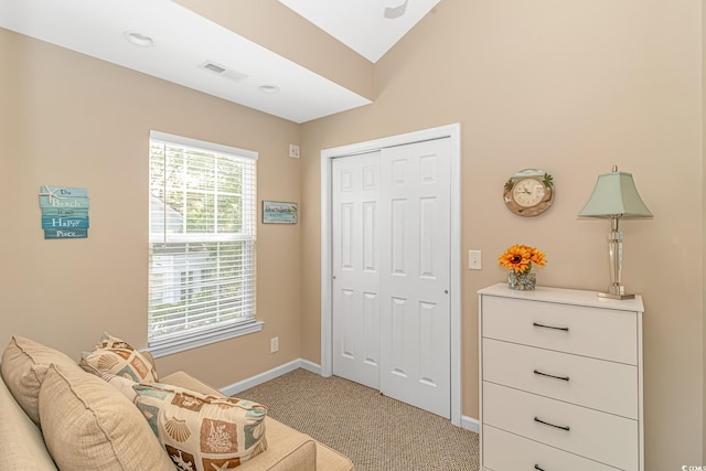 living area with light carpet