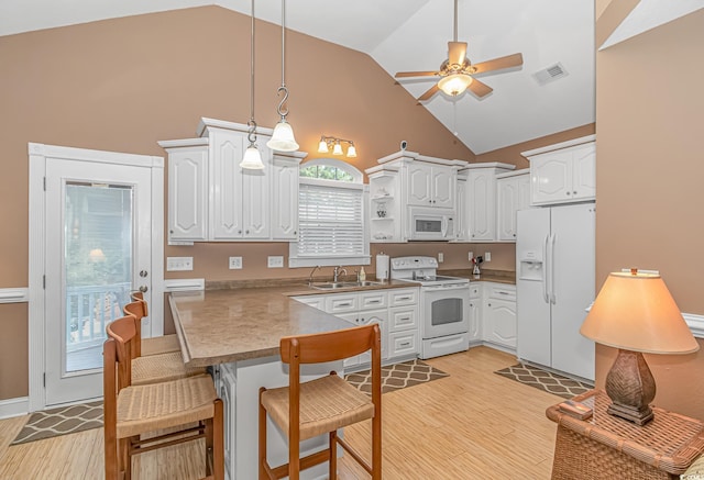 kitchen featuring ceiling fan, white cabinets, pendant lighting, and white appliances