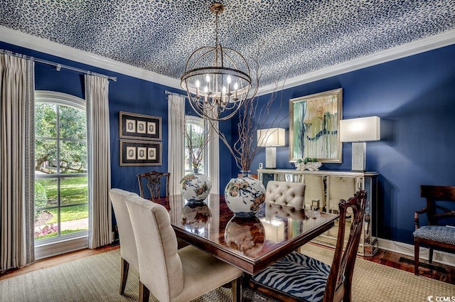 dining space featuring a wealth of natural light, crown molding, a notable chandelier, and hardwood / wood-style floors