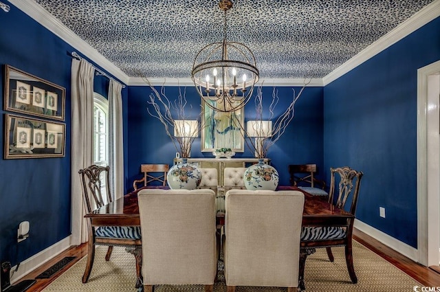 dining area with wood-type flooring, a chandelier, and crown molding