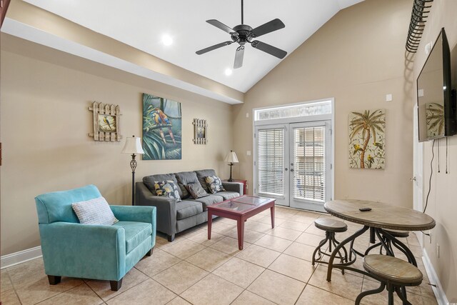 living room with ceiling fan, light tile patterned floors, high vaulted ceiling, and french doors