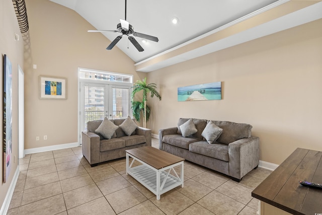 tiled living room with ceiling fan, high vaulted ceiling, and french doors