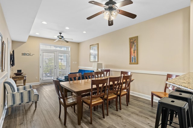 dining space featuring ceiling fan and light hardwood / wood-style flooring