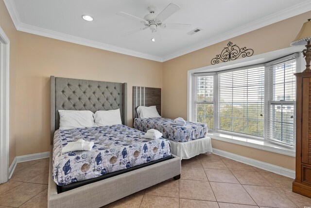 bedroom with light tile patterned floors, ornamental molding, and ceiling fan