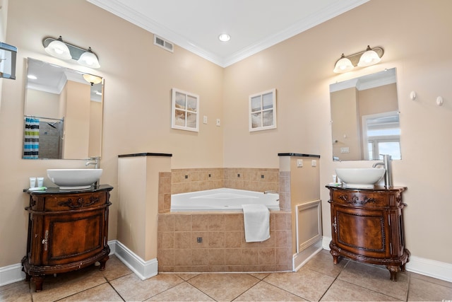 bathroom featuring tile patterned flooring, ornamental molding, shower with separate bathtub, and vanity