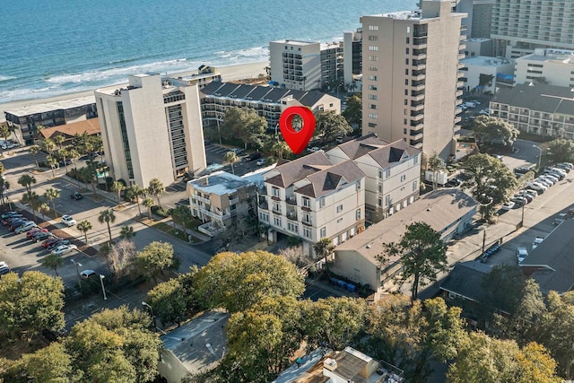 bird's eye view featuring a water view and a view of the beach