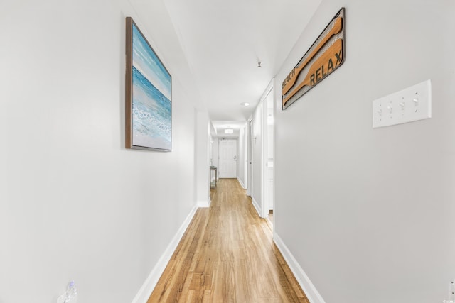 corridor featuring light hardwood / wood-style floors