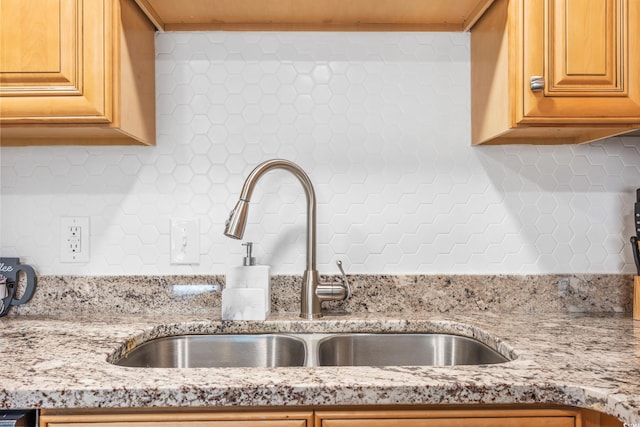 details with sink and light stone countertops