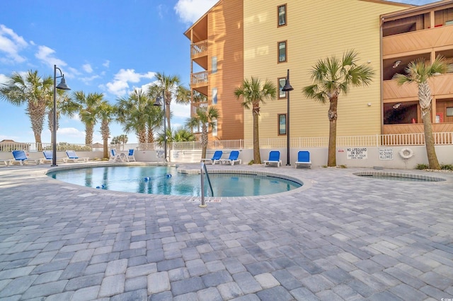 view of pool featuring a patio area