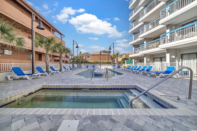 view of swimming pool featuring a patio area