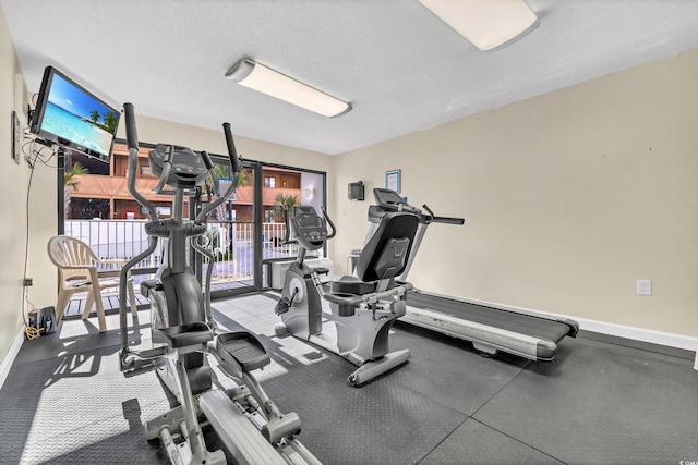 workout area with a textured ceiling