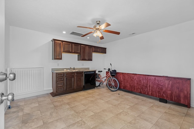 kitchen with black dishwasher, sink, and ceiling fan