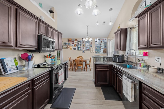 kitchen with a notable chandelier, light hardwood / wood-style flooring, stainless steel appliances, hanging light fixtures, and lofted ceiling