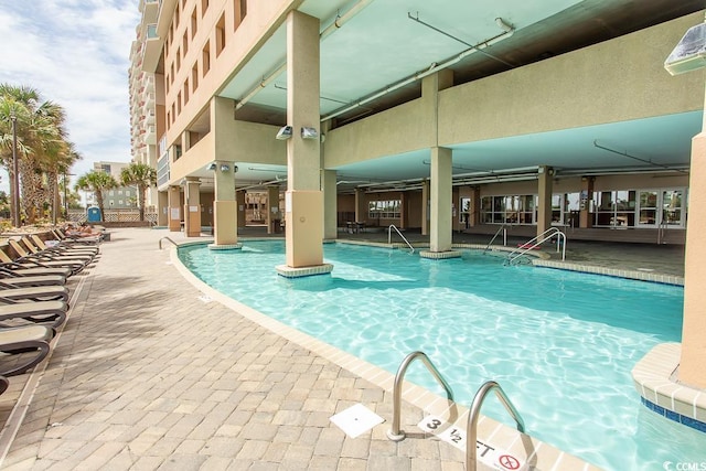 view of swimming pool featuring a patio