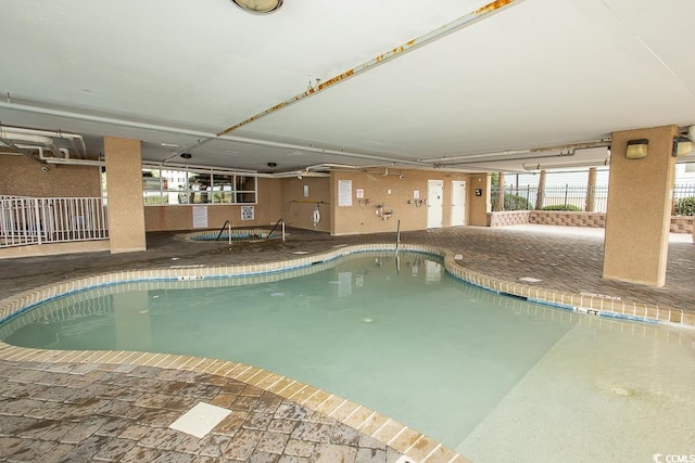 view of pool featuring a patio