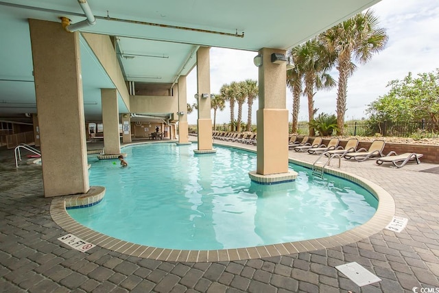 view of swimming pool featuring a patio area