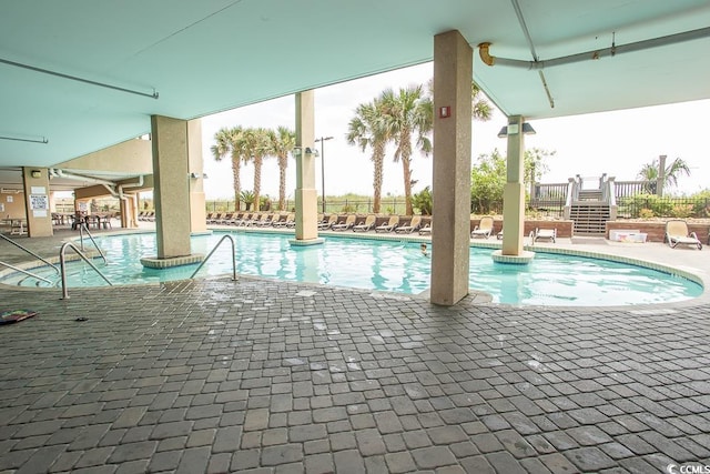 view of swimming pool with a patio