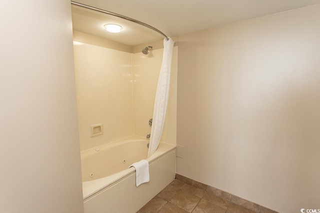 bathroom with shower / bathtub combination with curtain and tile patterned floors