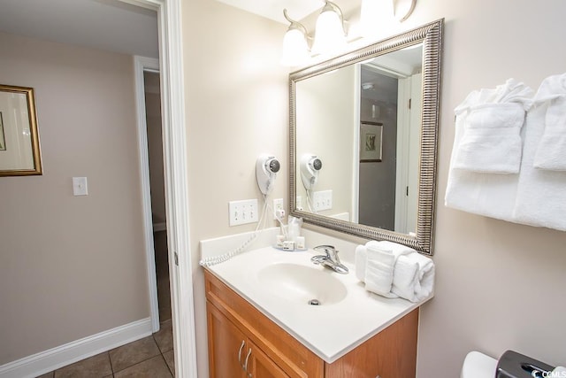 bathroom with tile patterned floors and vanity