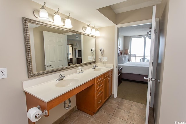 bathroom with ceiling fan, vanity, and tile patterned floors