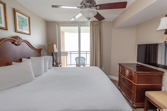 bedroom featuring ceiling fan and access to exterior